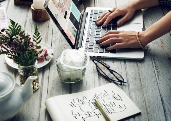 Side view of woman using computer laptop